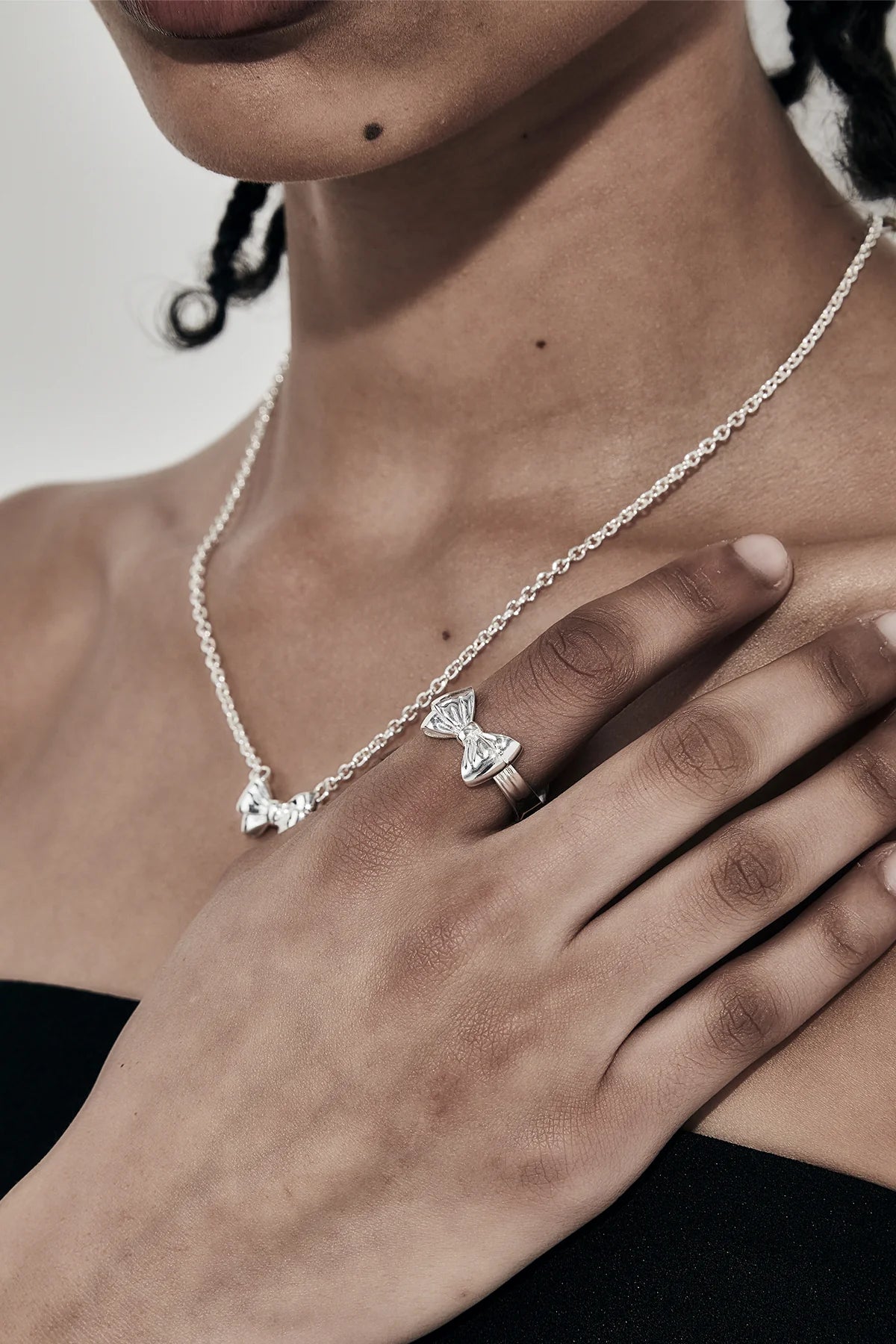 TWIN BOW RING